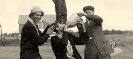 Old photograph of three men drinking
